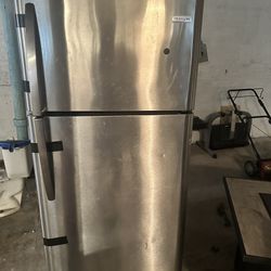 Two Fridges One Stainless Steel One Black 