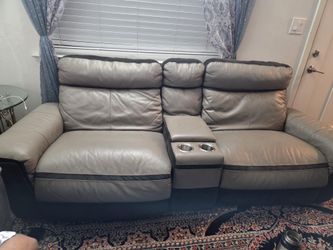 Seven seat leather sofa, six recliner and have charger space in the side with two small storage with