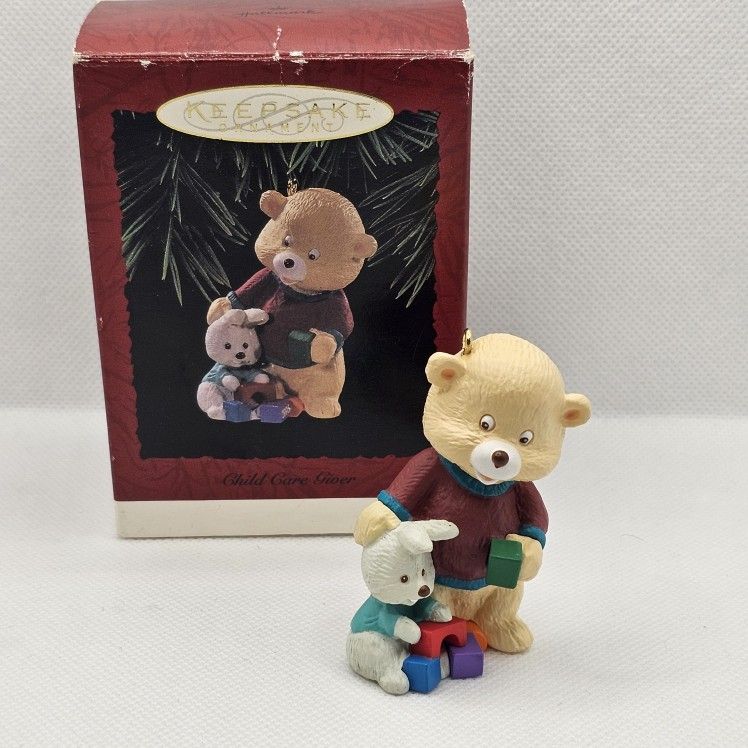 Hallmark Keepsake Christmas Ornament child care giver babysitter bear blocks
1996
Ornament is in great condition, no flaws
Box has some storage wear