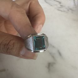 Beautiful 925 Sterling silver ring w/ blue emerald cut Cz stone , size 8, marked Sterling w/a symbol