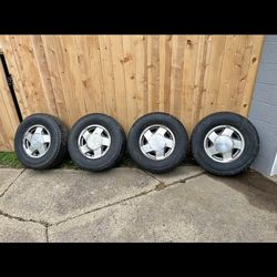 5 lug Chevy factory rims and tires  Cash Only