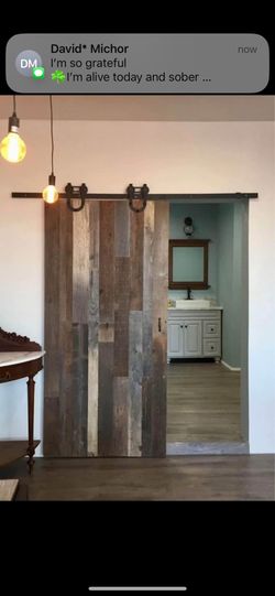 Custom-made solid reclaimed wood Barn door With Hardwear 
