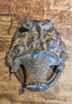 Antique cast iron basket of flowers door knocker
