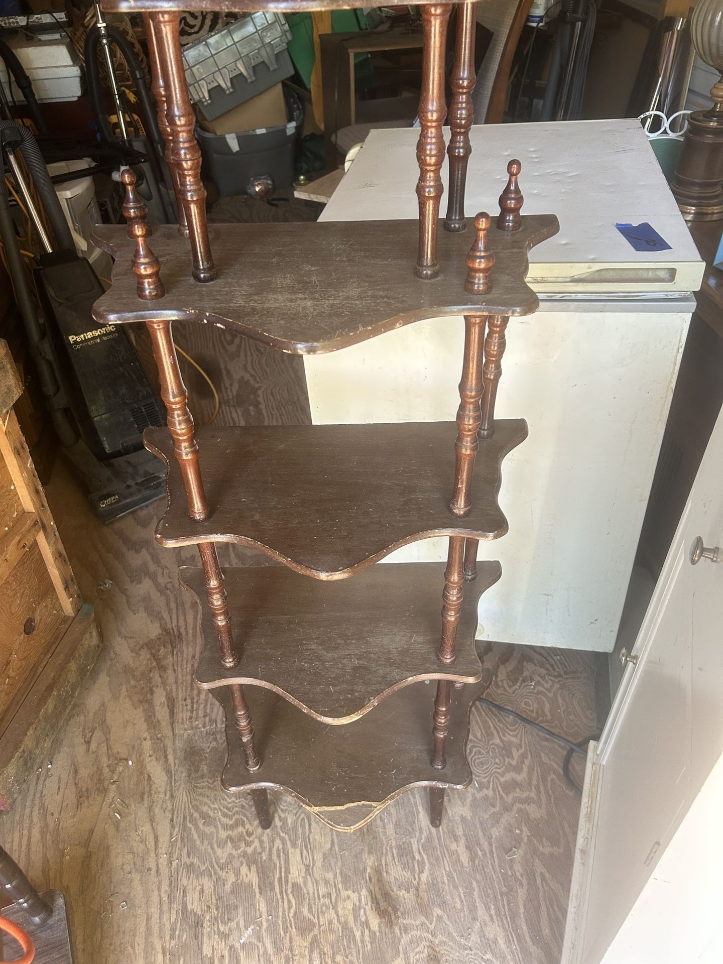 A wood shelf its 53 inches tall 13 inches wide and 11 inches deep