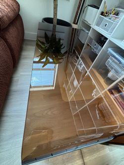 BROWN GLASS COFFEE TABLE