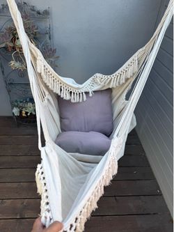 Hanging chairs with pillows