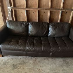 2 brown leather sofas / one is a futon