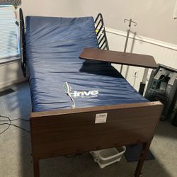 Electric hospital bed and adjustable hospital side table.