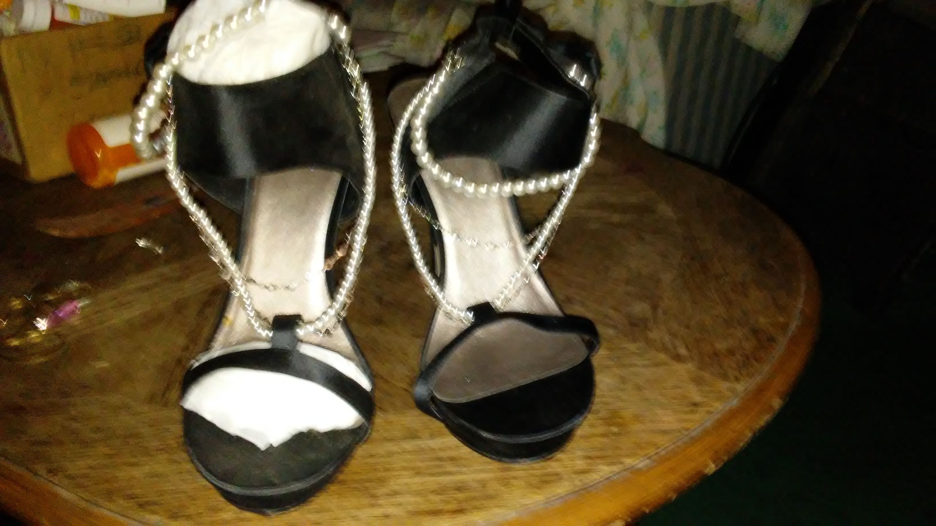 High heels they are hand made never worn. Price is negotiable... Has chains and pearl needs to go with them