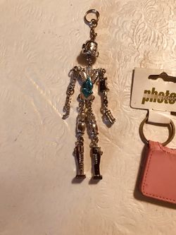 Individual Keychains, that’s a very light robot, US Coast Guard, Atlanta Falcons, and pink one for photos ($6.50 for 1 or $20 for 4)