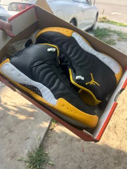 black and yellow Jordan’s