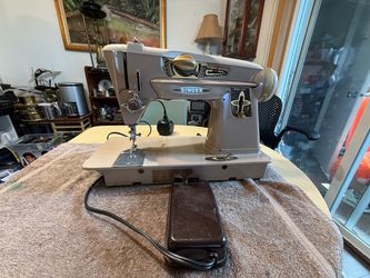 The Vintage Singer 500A Rocketeer Sewing Machine Pedal is a beige domestic sewing machine pedal from the Singer brand, known for its smooth operation.