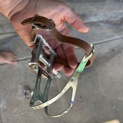 Bike pedals with toe clips (metal/leather straps. 