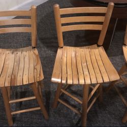4 Wood swiveling bar stools. Nothing Wrong With them 