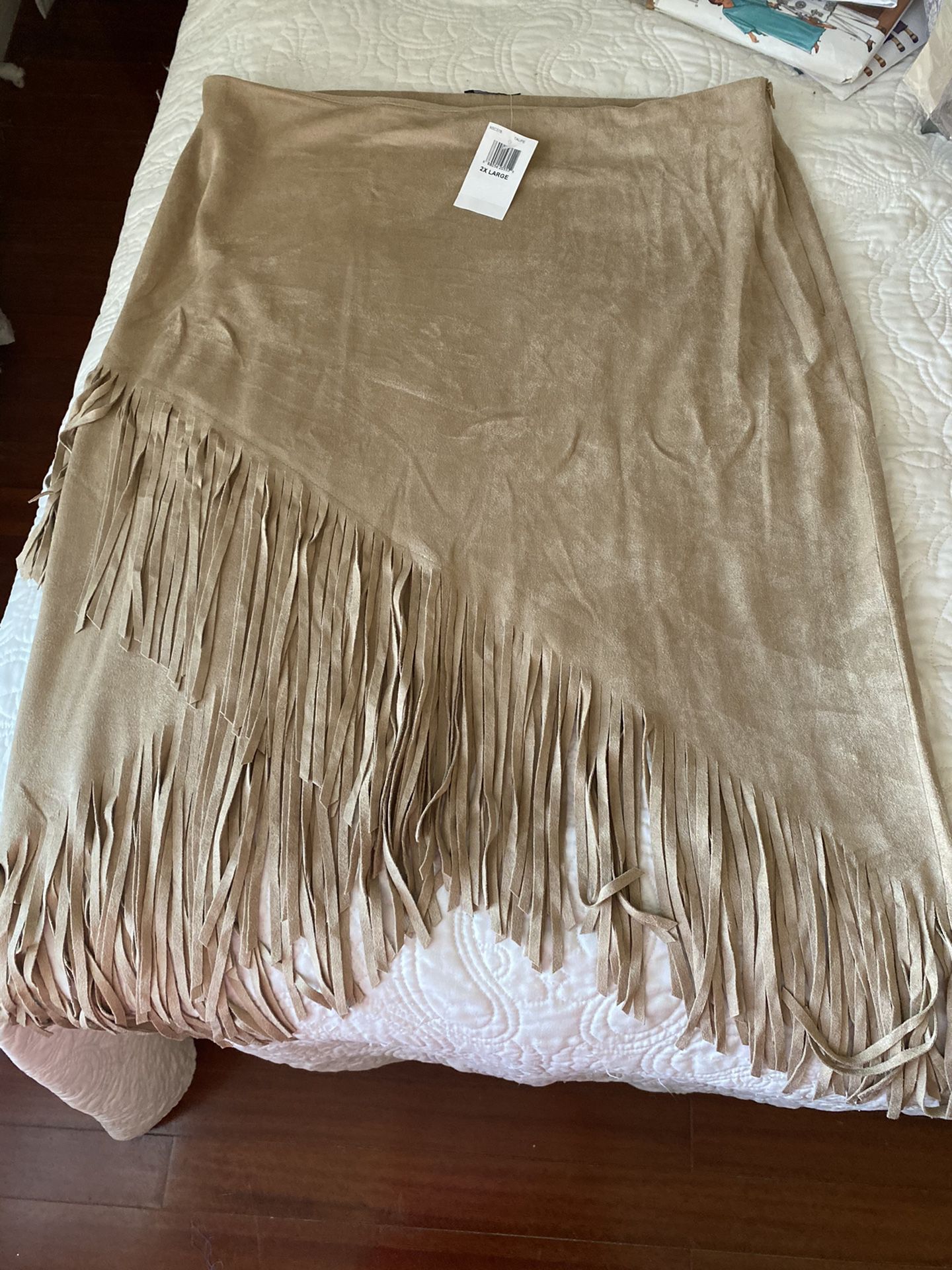 From Nordstrom, Soprano faux suede natural beige color skirt w/ cross cross fringe bottom,