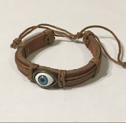 Brown leather bracelet with hamsa evil eye charm