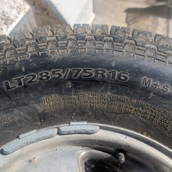 Three tires and rim for GM