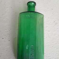 Vintage bottle. Vintage Green pharmacy bottle reads NOT TO BE TAKEN.  6.75 inch tall. 