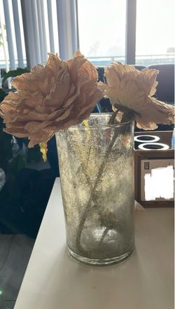 Rustic burlap woven fabric flower arrangement in a vintage silver mercury style glass vase.