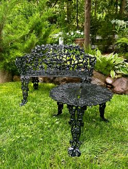bench and table set in black cast iron