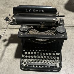 Antique 1930’s LC Smith 8 11  typewriter has 5 rows on the keyboard.  The standard key QWERTY Keyboard plus the additional top row for accounting 
