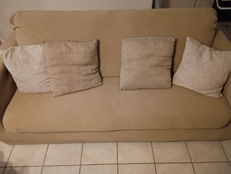 Sleep couch with 2 couch covers.