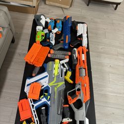 Around 30 Nerf Guns With Bullets And All The Mags And Attachments