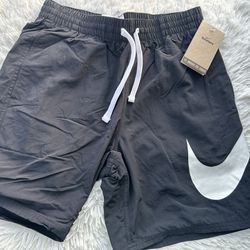 Nike black Swim Shorts with White Logo in size small #NESSE506-001