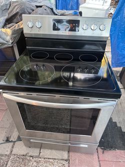 Selling a Frigidaire 30" Electric Range (Model: FFEF3054TST).  Stainless steel finish with a black smooth ceramic glass cooktop. Clean inside and out,