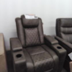 Power Recliner Chair In Faux Leather, Features Storages And Cup Holders.