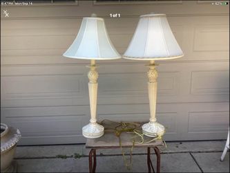 2 very tall cream color lamps like brand new 3 way bulbs they take ,these lamps are perfect used very very little if that ..was bought for staging a h