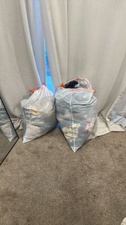 Girl Two Mixed Bags Of Clothes