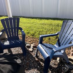 Pair of blue patio Adirondack chairs (plastic)