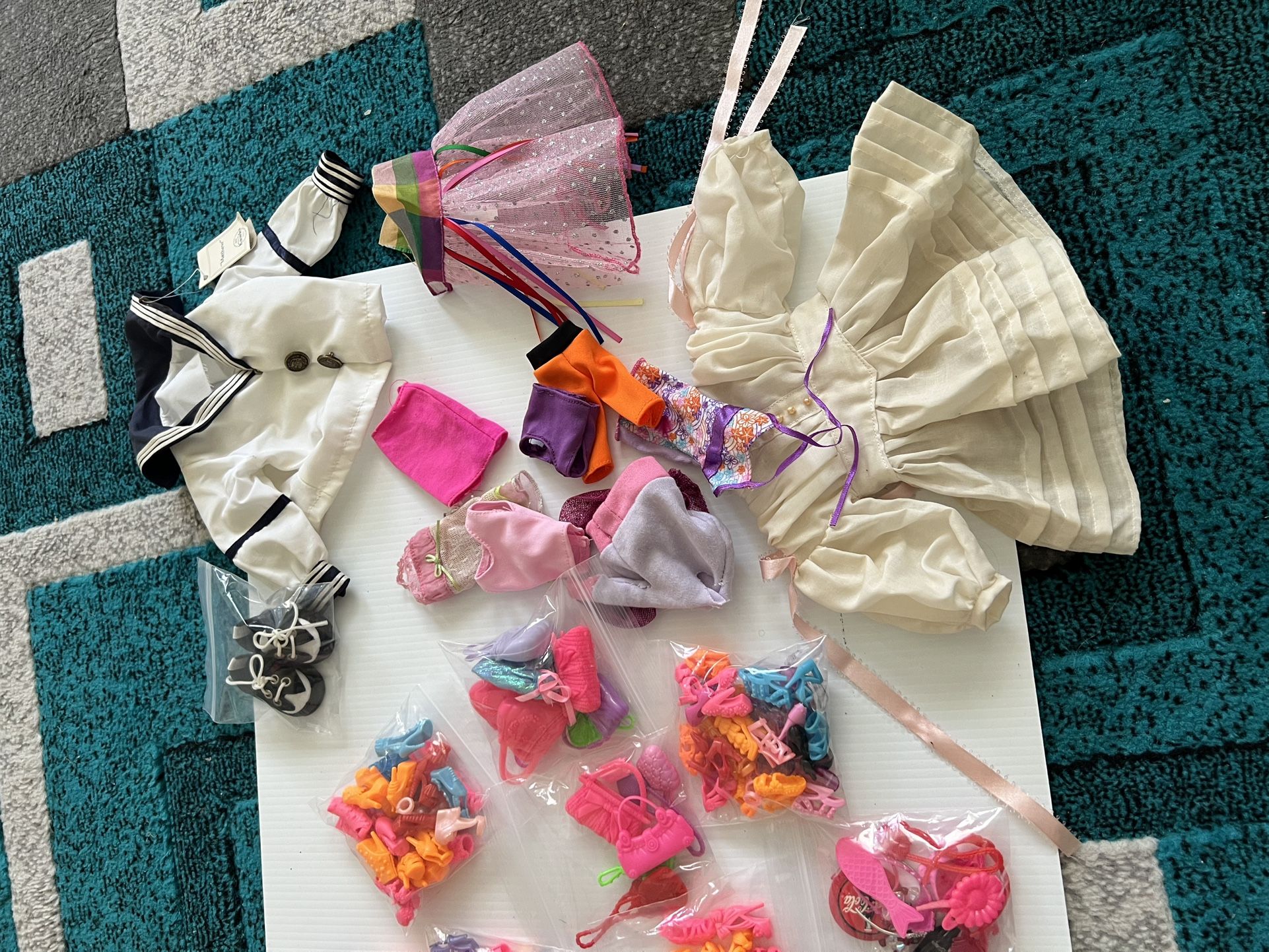 Lot of VTG/Modern Barbie Shoes,accessories , Doll clothes and shoes. All shoes are paired.