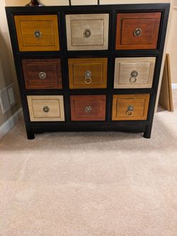 9 Drawer Dresser/Cabinet.  Different Types of Wood.  Beautiful Handles.  Great Condition.