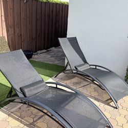 Two Black Mesh Lounge Chairs 