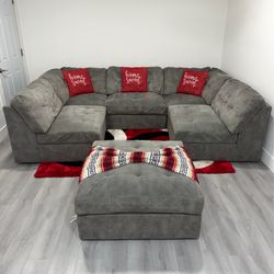 6-Piece Modular Charcoal/Gray Sectional Sofa. Delivery available for an additional cost.