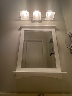 Bathroom mirror and medicine cabinet