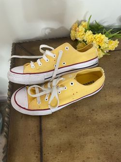 yellow Converse Chuck Taylor All Star Low Top Sneakers.