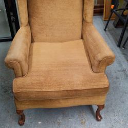 Brown wing back chair