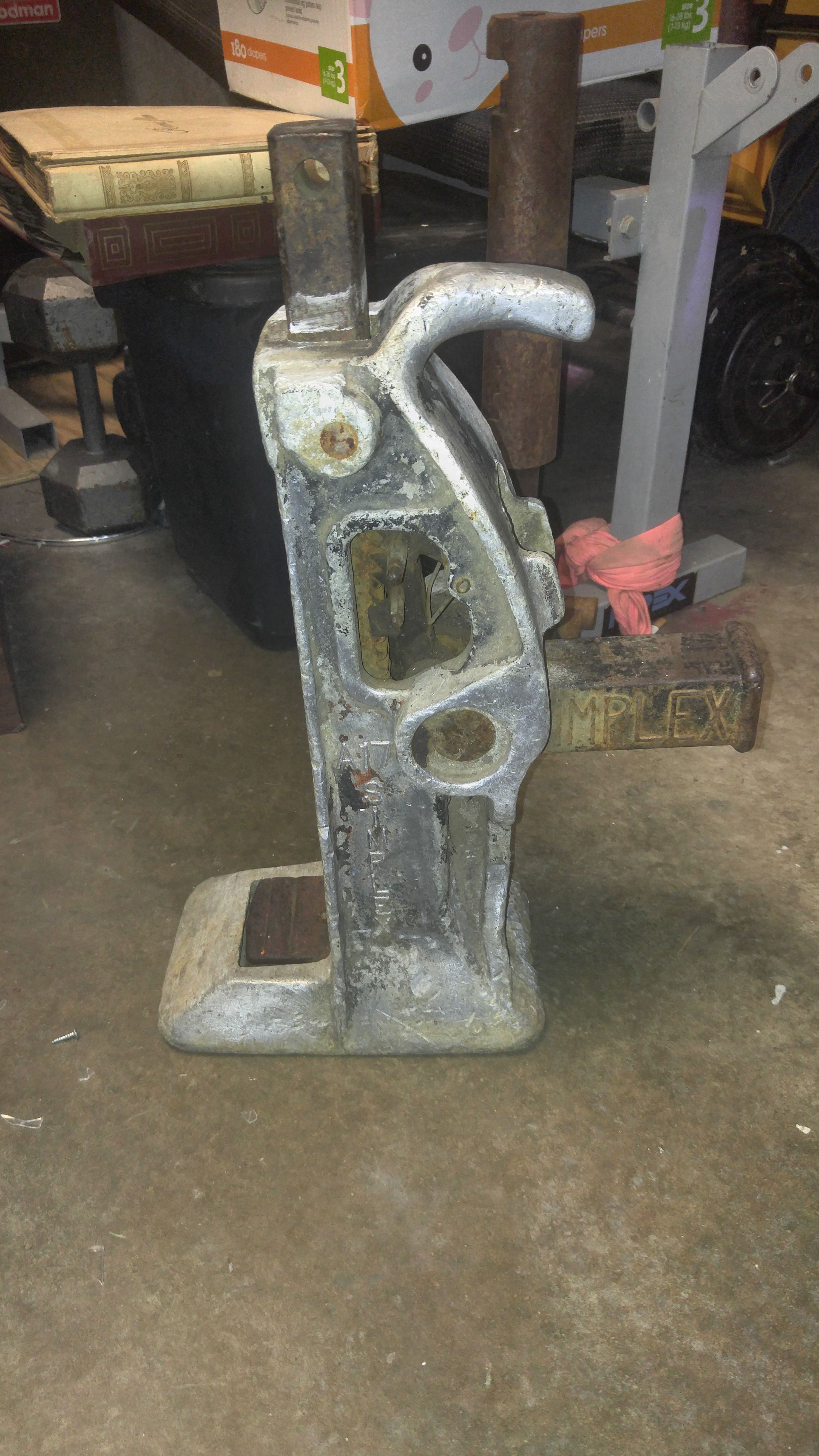 A vintage Simplex A17 aluminum 15 ton railroad jack with 13 inch lift