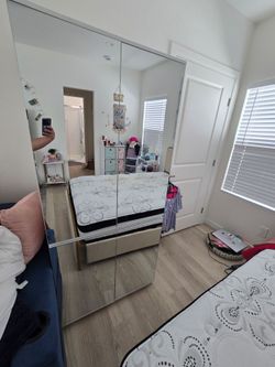 Closet armoire with storage mirror doors