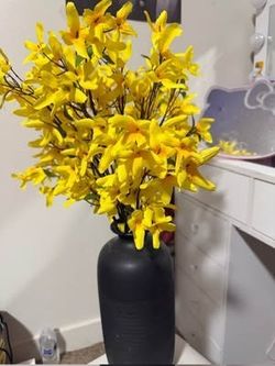 yellow flowers and vase