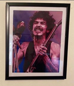 Custom art piece of Carlos Santana on black frame