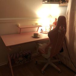 pink desk with gaming chair 