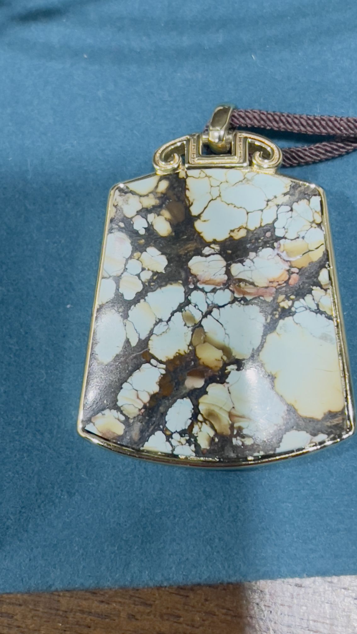 Gold plant turquoise pendant