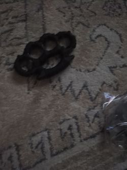 Metal paper weight and belt buckle