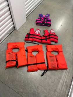 3 adult sized life vests