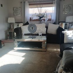 A beautiful charcoal gray Suffer with glass tables