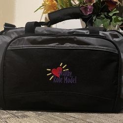 Black and gray duffel bag with 'Healthy Role Model' embroidery